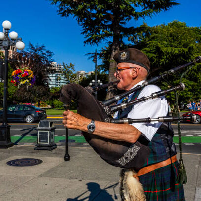 culture richness Victoria, BC, Canada - July 18th, 2024: Performer of Scottish melodies on a downtown street